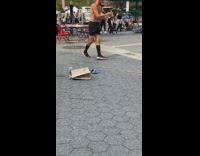 Shirtless guy black shorts red face mask 