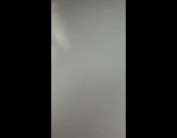 Guy on escalator climbs on ledge in mall