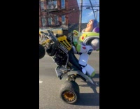 Buzz Lightyear do wheelie stunt with ATV