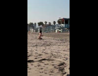 Woman red bikini bend pose at beach