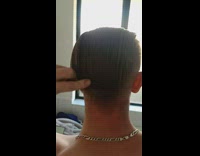 Hair combed at the back and then splits 