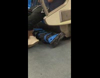 Guy black trash bag blue tape subway 