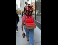 Person wearing Pizza Hut restaurant as costume 