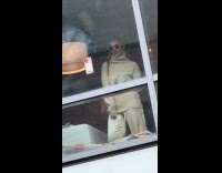 Woman makes video phone on the window