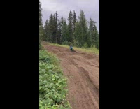 Man on Dirt Bike Passes Through Curve Trail
