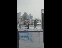 Woman jean jacket photo shoot rooftop graffiti wall