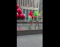 Christmas trolls dancing and one grabs the others butt