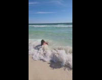 Woman gets knocked over by wave