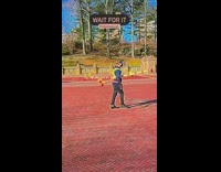 Guy wears yellow sticks around body park 