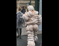 Person crossing street puffy fluffy costume rolls