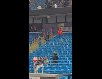 Girl in blue sparkly dress takes pictures