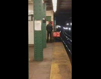 Man pees in corner of subway station next to red do not enter sign