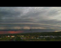 Curved edge of storm clouds sunset overcast