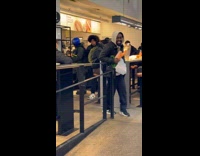 Man with popeyes chicken dance inside chipotle