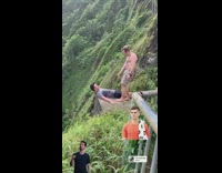 man laying down head over ledge