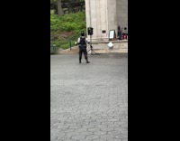 Man wearing batman mask dancing to band 
