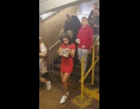 Mole rats mascot costume walk down stairs at subway station