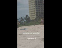 Woman printed bikini kneel pose beach boyfriend