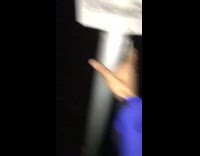 MUSIC guy in white hoodie shaking medal pole