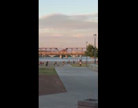 Guy jump exercise video lake bridge scooter