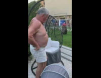 Grandpa Sits on Swing at Yard and Falls
