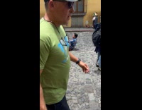 Collab IITW - Man sits street middle photoshoot of woman