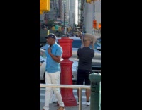 Dog standing on hoomans shoulders on street