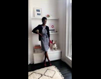 Black girl modeling next to french bull dog frenchie