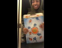 Girl in green hoodie getting cereal snack Reese Puffs scared by dad behind her