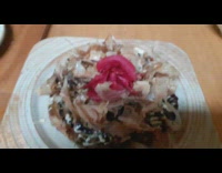 Guy shows plate of food at restaurant 