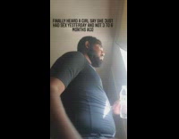 Guy looking out window drinks water