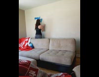 Woman paints world map on wall