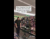 Black shirt girl aisle shopping cart skinny