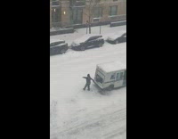 Woman black jacket dance USPS Truck snow