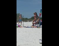 Woman red bikini hand behind head beach