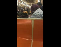 Man cleaning off his shears in the subway