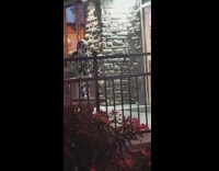 Girl cow jumpsuit dance outside store night