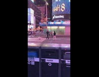 Woman sit middle of street stopped by a cop