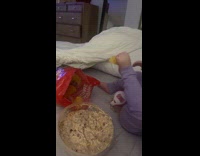 Kid grabbing chips using toes 