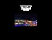 Couple caught kissing while riding ferris wheel