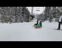 Snowboarder does 180 spin and trips on the snow