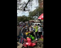 Girl takes photo at Mardi Gras parade 