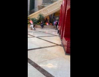 Woman fight stances near child in mall