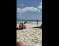 Guy tries and fails to do handstand on beach