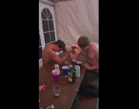 Guy arm wrestle and wrestle on the ground at screamo metal music party