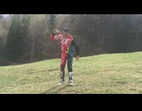 Guy opens bottle with wheel of moving dirt bike 