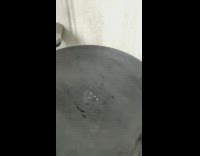 Water droplets bounces on hot pan in slow motion