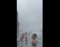 Woman bikini poses near bar hot springs