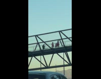 Three women in Santa Claus costume danced on the bridge