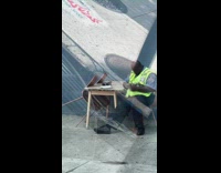 Crossing guard sits while cars honk 